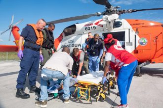 NASSAU, Bahamas (Sept. 6, 2019) U.S. Navy Sailors and Coast Guardsmen transport a patient in response to Hurricane Dorian in the Bahamas, Sept. 6, 2019. In support of foreign disaster relief efforts in The Bahamas, the Secretary of Defense authorized U.S. Northern Command to provide transportation logistics for the movement of USAID and third party humanitarian commodities and personnel throughout the region and to conduct assessments of critical transportation nodes to facilitate the delivery of humanitarian assistance and maximize the flow of disaster relief into the area.(U.S Navy photo by Mass Communication Specialist 3rd Class Katie Cox/Released) 190906-N-CE622-0244